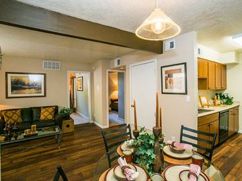Dining area and living room at tierra pointe apartments in Albuquerque, nm